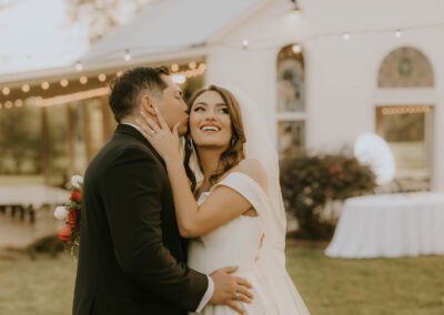 Soft lighting of a couple kissing in front of the chapel