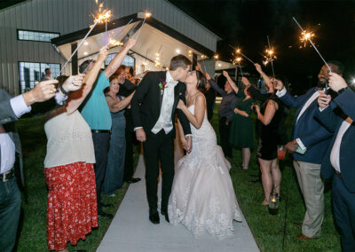 couple running through sparklers