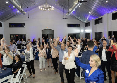 group of people at a party in the farm house