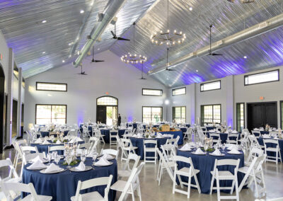 Indoor view of the farmhouse with tables and chairs set up.
