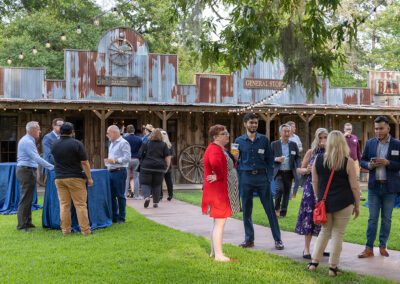 People dressed in business casual attire standing outside the General Store.